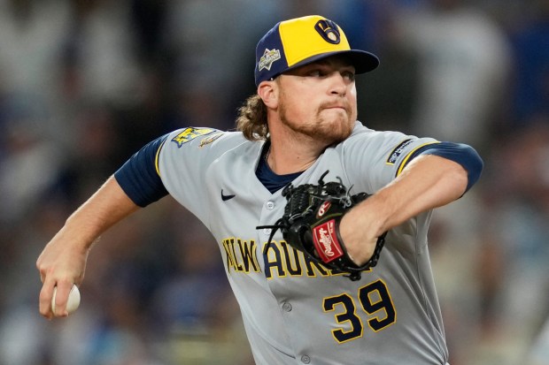 Milwaukee Brewers relief pitcher Chad Patrick throws to the plate...