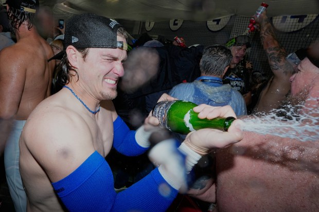 Dodgers utility player Kiké Hernández celebrates their win against the...