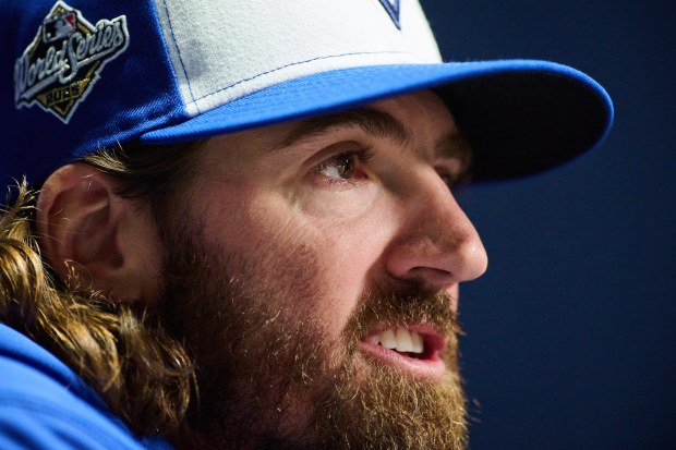 Toronto Blue Jays' Kevin Gausman speaks to media during the Toronto Blue Jays' media day ahead of the 2025 World Series against the Los Angeles Dodgers in Toronto, on Thursday, Oct. 23, 2025. (Sammy Kogan/The Canadian Press via AP)