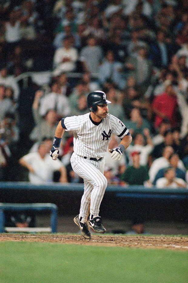 New York Yankees' Don Mattingly takes off for a trip around the bases after hitting the ball out of the park in the sixth inning of game two of the American League division playoff series against the Seattle Mariners on Wednesday, Oct. 4, 1995 at Yankee Stadium in New York.