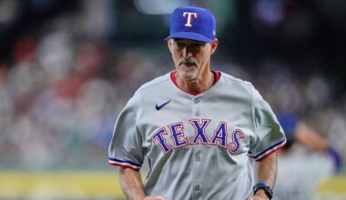 Texas Rangers pitching coach Mike Maddux (31) heads back to the dugout after a mound visit during the first inning of a baseball game against the Houston Astros, Friday, July 11, 2025, in Houston. (AP Photo/Kevin M. Cox)