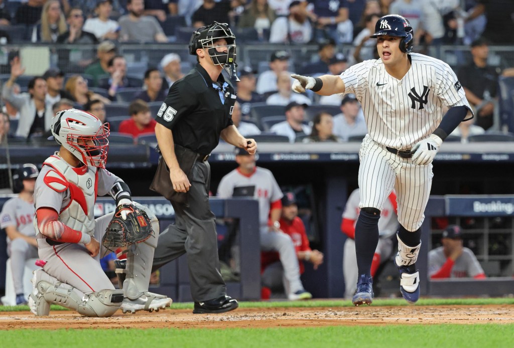 Anthony Volpe points to the Yankees' dugout after hitting a solo home run in the second inning of the Yankees' 3-1 loss to the Red Sox in Game 1 of their AL wild-card series on Sept. 30, 2025.