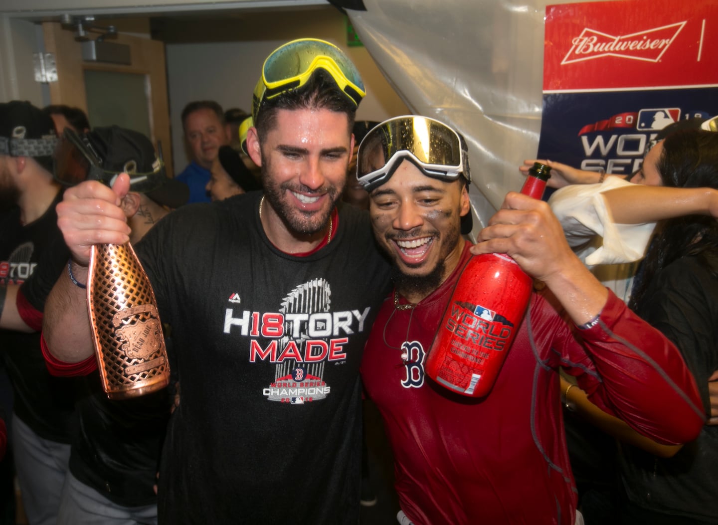 J.D. Martinez (left) and Mookie Betts celebrated winning the 2018 World Series together as Red Sox teammates.