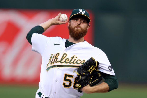 Oakland Athletics starting pitcher Paul Blackburn (58) delivers against the Seattle Mariners in the first inning of their MLB game at the Coliseum in Oakland, Calif., on Tuesday, Sept. 19, 2023. (Ray Chavez/Bay Area News Group)