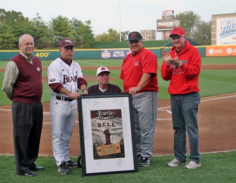 Howard Bell is honored at the first Battle for Bell in 2012 with Missouri State coach Keith Guttin and Drury coach Mark Stratton alongside him in pre-game, plus MSU president Clif Smart and Drury president Todd Parnell.