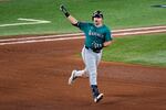 Seattle Mariners' Cal Raleigh celebrates his solo home run as he rounds the bases against the Toronto Blue Jays during the sixth inning in Game 1 of baseball's American League Championship Series, Sunday, Oct. 12, 2025, in Toronto.
