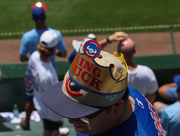 A Cubs fan wears a giveaway crown referencing Cubs right fielder Kyle Tucker before a game against the Mariners at Wrigley Field on June 21, 2025, in Chicago. (John J. Kim/Chicago Tribune)