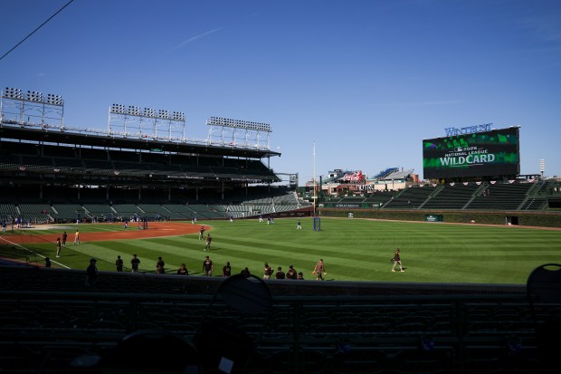 Chicago Cubs players and San Diego Padres players warm up...