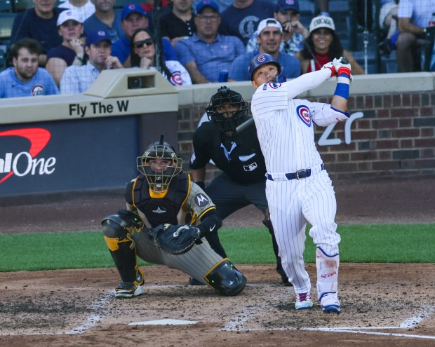 Cubs right fielder Seiya Suzuki watches his solo home run...
