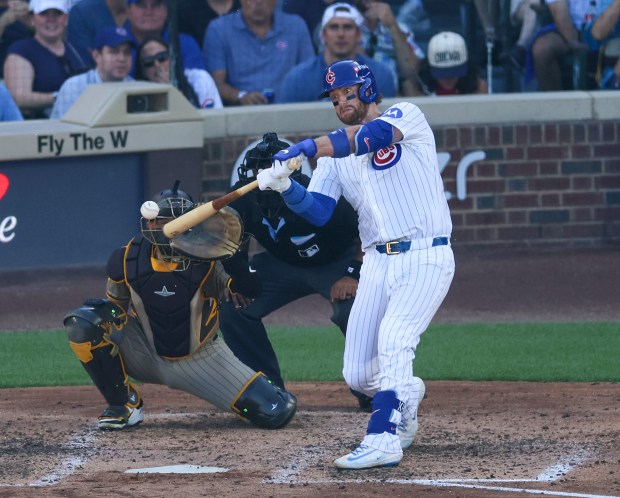 Chicago Cubs catcher Carson Kelly hits a solo home run...