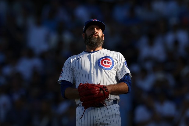 Cubs relief pitcher Andrew Kittredge takes a breath before throwing...