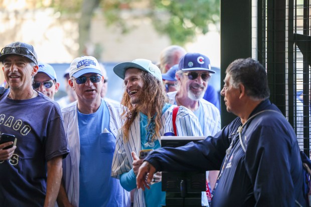 Fans wait to enter for the bleacher seats before Game 3 of the National League wild-card series against the San Diego Padres at Wrigley Field on Oct. 2, 2025. (Eileen T. Meslar/Chicago Tribune)