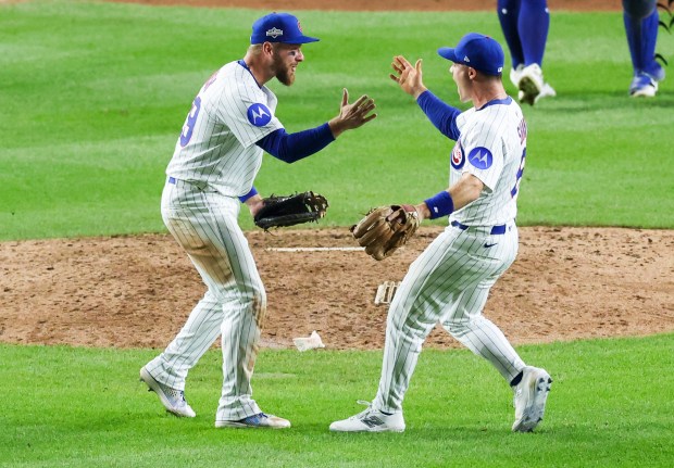 Cubs first baseman Michael Busch, left, and third baseman Matt...