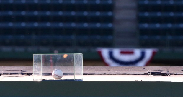 In this Oct. 14, 2015, file photo, a baseball that was hit for a home run by Chicago Cubs' Kyle Schwarber in the seventh inning in Game 4 of the NLDS sits encased atop the right field video board at Wrigley Field in Chicago. (Chris Sweda/Chicago Tribune)