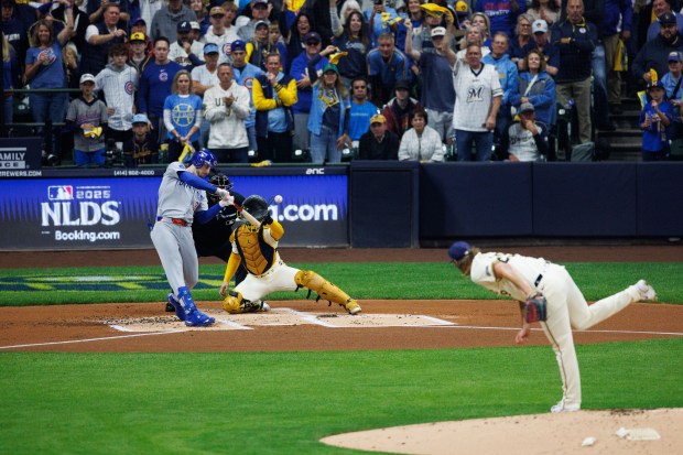 Cubs designated hitter Kyle Tucker strikes out against Brewers pitcher...