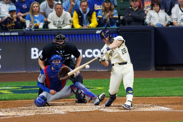 Milwaukee Brewers first baseman Andrew Vaughn (28) hits a solo-homer...