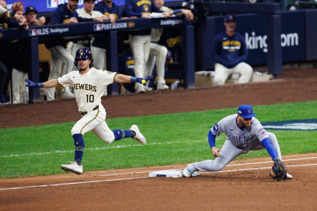 Milwaukee Brewers outfielder Sal Frelick (10) reaches first base safely...