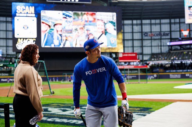 Cubs right fielder Seiya Suzuki walks on the field before...