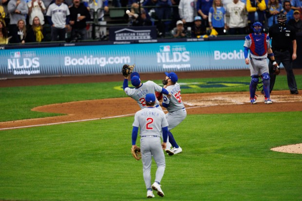 Chicago Cubs first baseman Michael Busch (29) catches a ball...