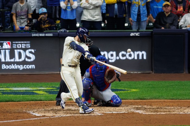 Milwaukee Brewers second baseman Brice Turang (2) hits a solo-homer...