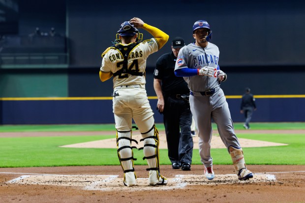 Chicago Cubs outfielder Seiya Suzuki (27) cross home plate after...