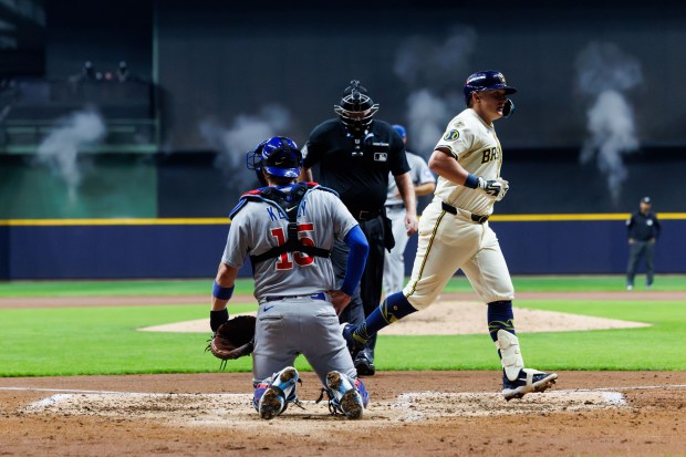 Brewers first baseman Andrew Vaughn crosses the plate after hitting...