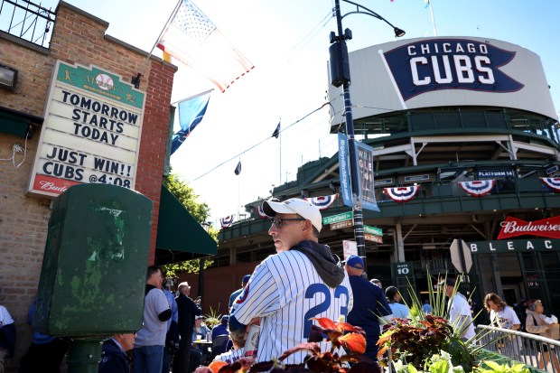 Fans gather outside of Wrigley Field in Chicago before Game 3 of the NL Division Series between the Cubs and the Milwaukee Brewers on Oct. 8, 2025. (Chris Sweda/Chicago Tribune)