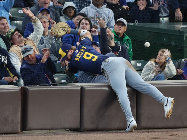 Milwaukee Brewers first baseman Jake Bauers (9) is unable to...