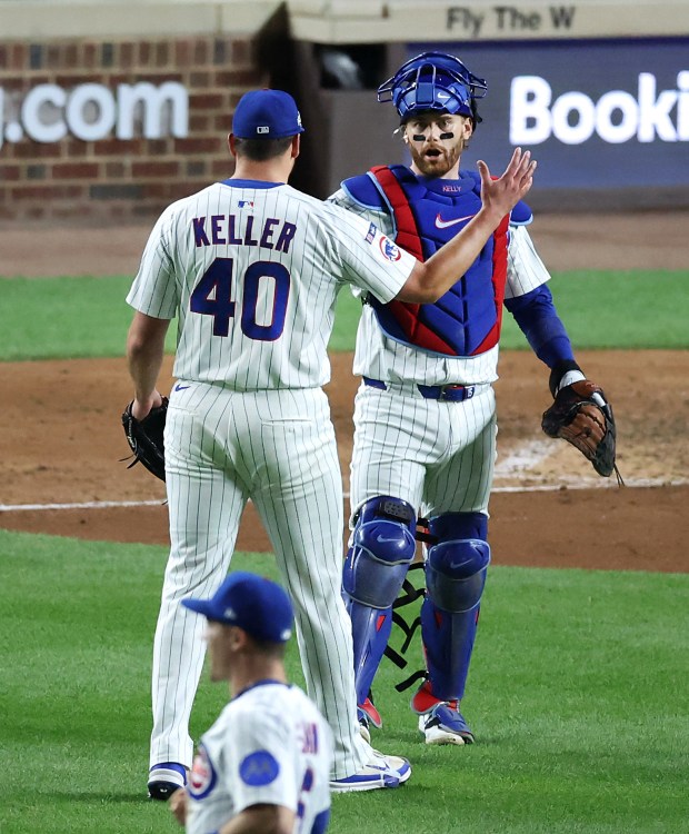 Chicago Cubs relief pitcher Brad Keller and catcher Carson Kelly...