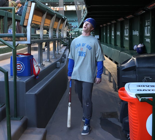 Chicago Cubs center fielder Pete Crow-Armstrong walks through the dugout as players prepare for Game 4 of the NL Division Series between the Cubs and the Milwaukee Brewers at Wrigley Field in Chicago on Oct. 9, 2025. (Chris Sweda/Chicago Tribune)