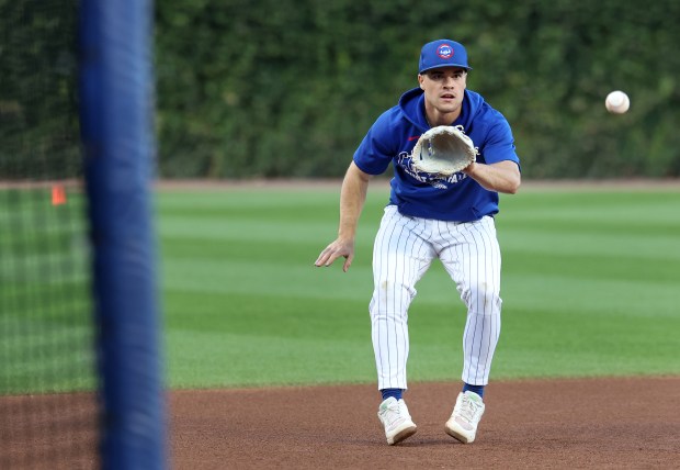 Cubs third baseman Matt Shaw takes fielding practice before Game 4 of the NL Division Series against the Brewers at Wrigley Field in Chicago on Oct. 9, 2025. (Chris Sweda/Chicago Tribune)