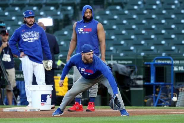 Cubs first baseman Michael Busch takes fielding practice before Game 4 of the NL Division Series against the Milwaukee Brewers at Wrigley Field in Chicago on Oct. 9, 2025. (Chris Sweda/Chicago Tribune)