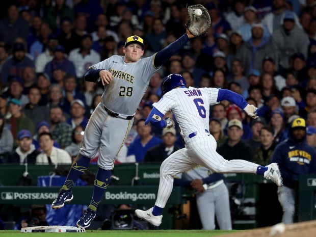 Milwaukee Brewers first baseman Andrew Vaughn is pulled off the...