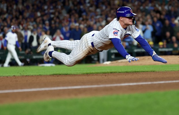 Cubs third baseman Matt Shaw steals third base in the...