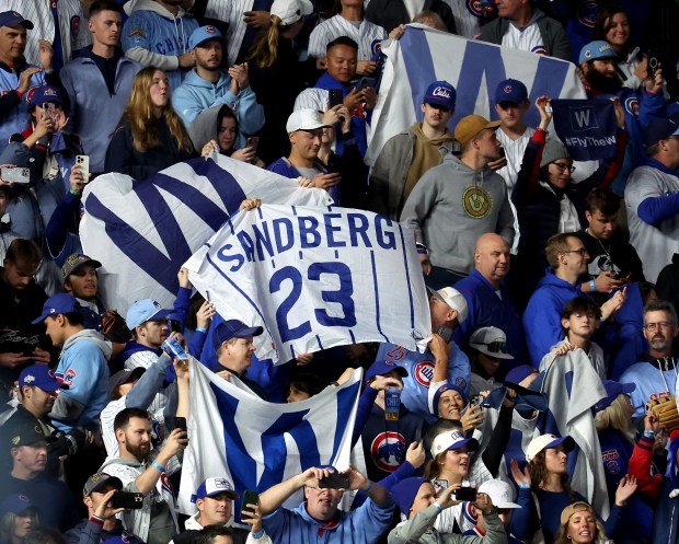 A Ryne Sandberg flag is waved among the "W" flags...