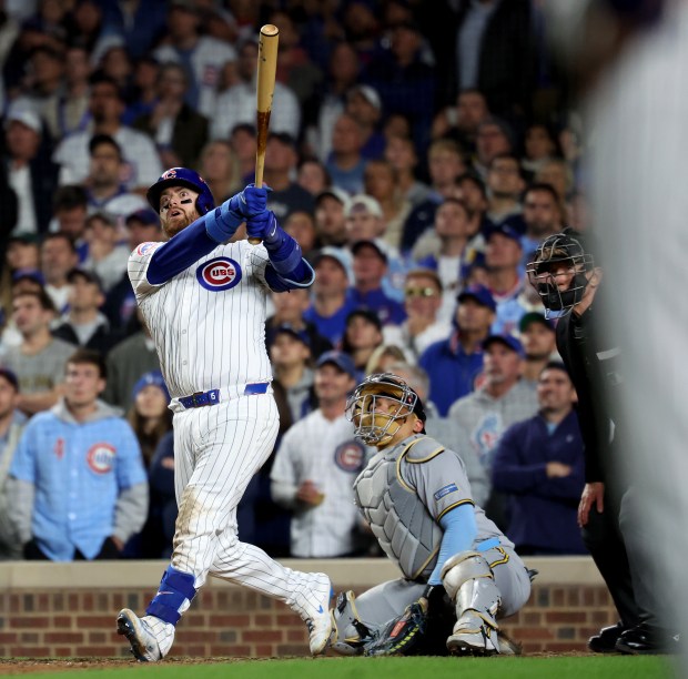Chicago Cubs catcher Carson Kelly watches the flight of his long foul ball that was initially ruled a home run in the seventh inning of Game 4 of the NL Division Series against the Milwaukee Brewers at Wrigley Field in Chicago on Oct. 9, 2025. (Chris Sweda/Chicago Tribune)