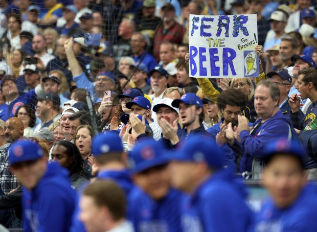 A Brewers fan shows support for the team before Game...