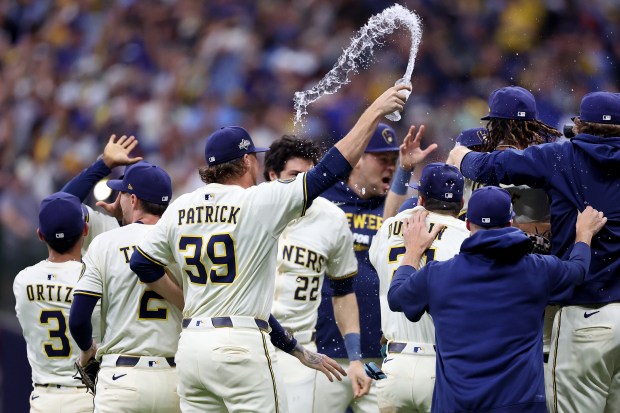 Reliever Chad Patrick (39) celebrates with teammates after the Brewers defeated the Cubs 3-1 in Game 5 of the NL Division Series on Oct. 11, 2025, at American Family Field in Milwaukee. (Chris Sweda/Chicago Tribune)