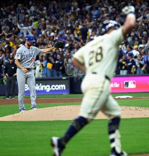 Chicago Cubs relief pitcher Colin Rea (53) stands on the...