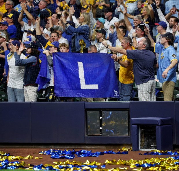 Brewers fans display an "L" flag after the Brewers defeated the Cubs in Game 5 of the NL Division Series on Oct. 11, 2025, at American Family Field in Milwaukee. (Chris Sweda/Chicago Tribune)