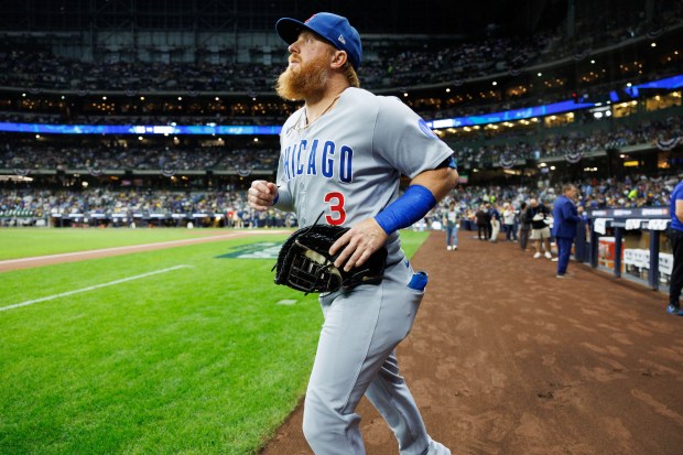 Cubs first baseman Justin Turner walks on the field before Game 2 against the Brewers on Oct. 6, 2025, in Milwaukee. (Armando L. Sanchez/Chicago Tribune)