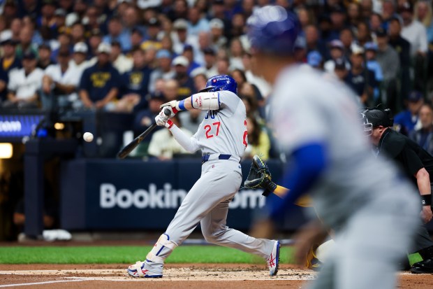Chicago Cubs outfielder Seiya Suzuki (27) hits a three-run homer...