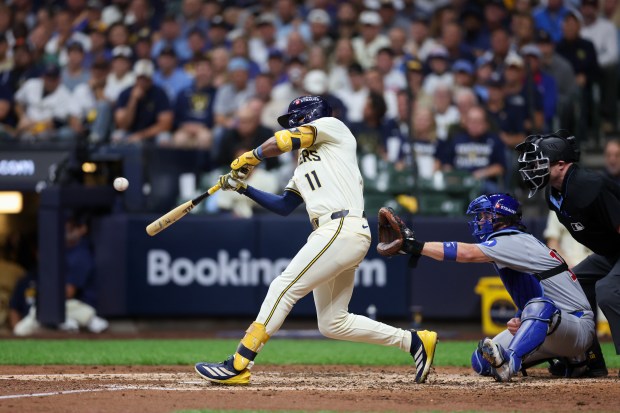 Milwaukee Brewers outfielder Jackson Chourio (11) hits a three-run homer...