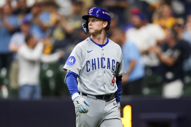 Chicago Cubs outfielder Pete Crow-Armstrong (4) walks to the dugout...