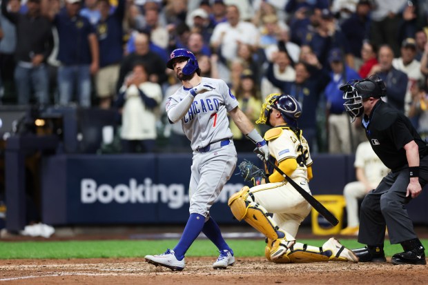 Dansby Swanson strikes out in the Game 2 loss to the Brewers on Oct. 6, 2025, in Milwaukee. (Armando L. Sanchez/Chicago Tribune)