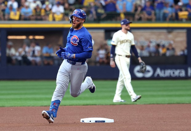 Chicago Cubs first baseman Michael Busch rounds the bases after...