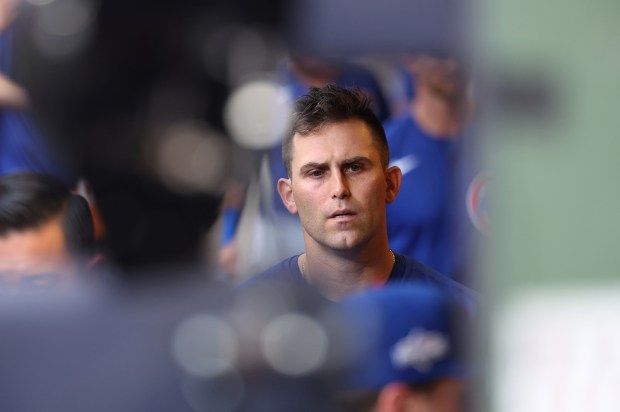 Chicago Cubs starting pitcher Matthew Boyd walks through the dugout...