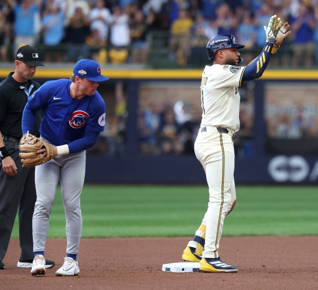 Milwaukee Brewers left fielder Jackson Chourio celebrates in front of...