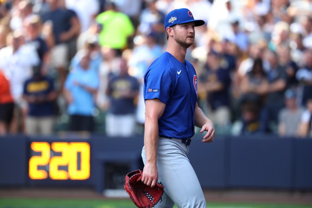 Chicago Cubs relief Michael Soroka walks to the dugout after...