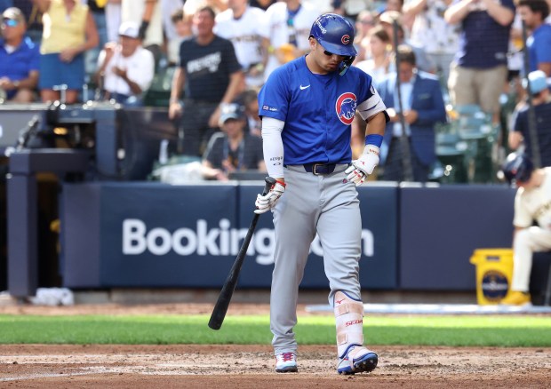 Chicago Cubs right fielder Seiya Suzuki walks back to the...